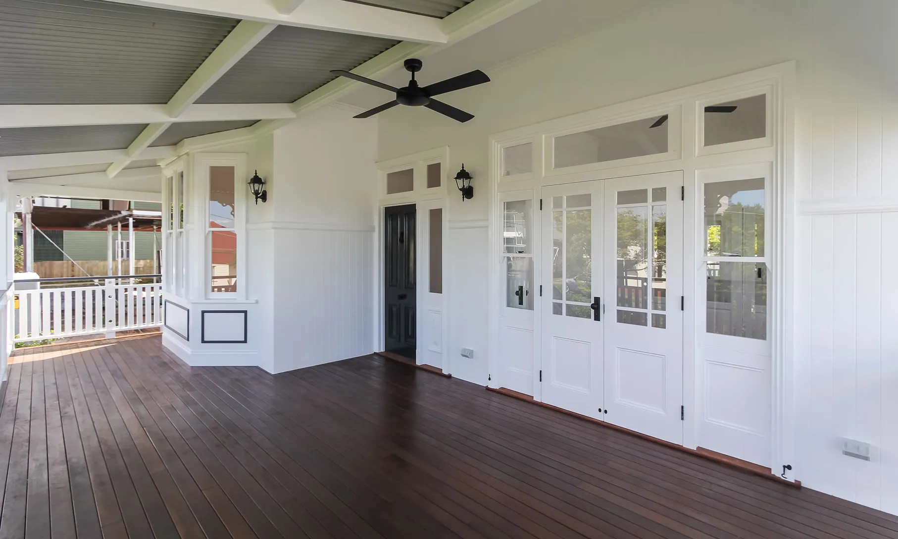 Front Deck with Bay Window and Black entry door in Queenslander Style Home Renovation