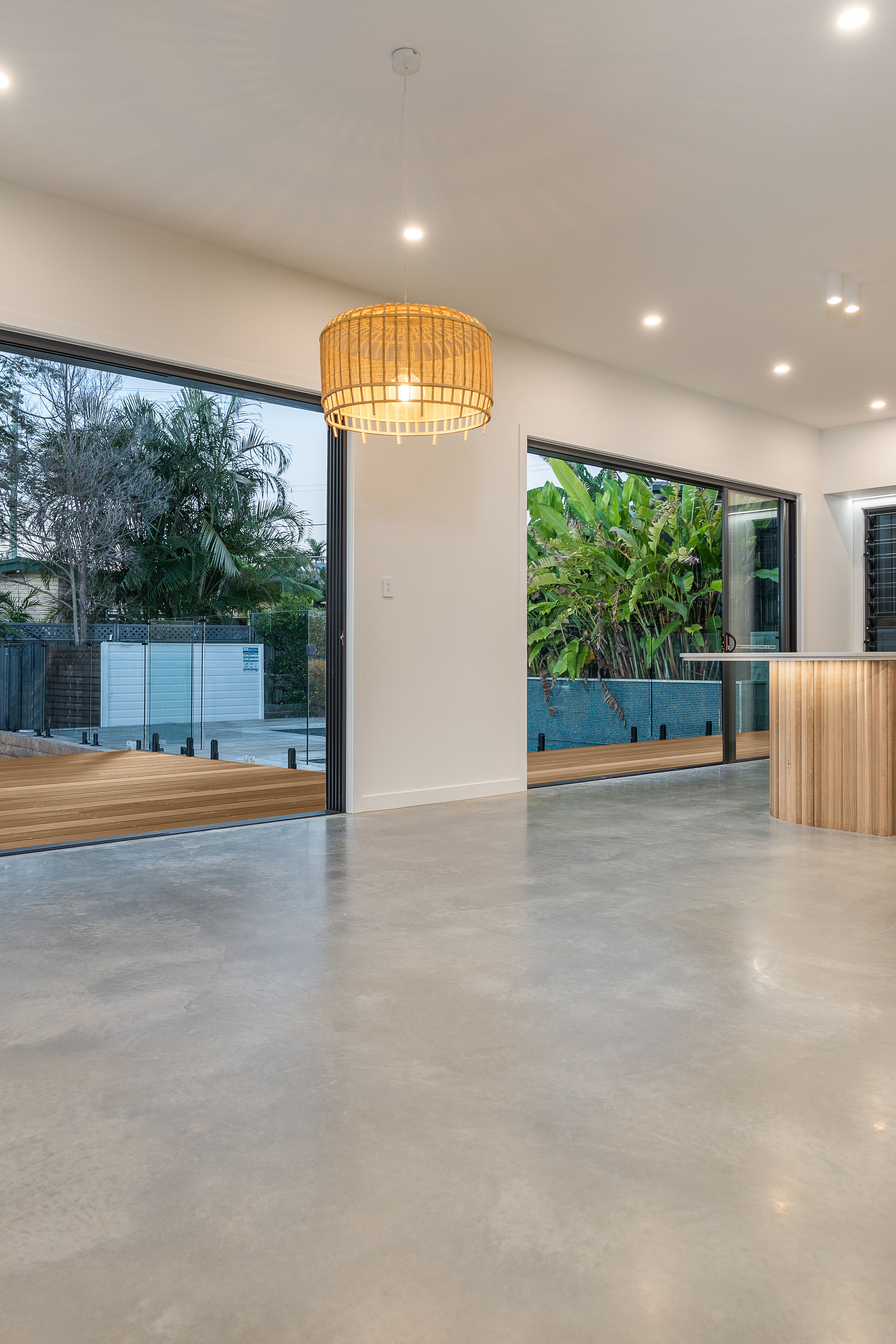 Living room-polished floors- Stacker door-pool-deck