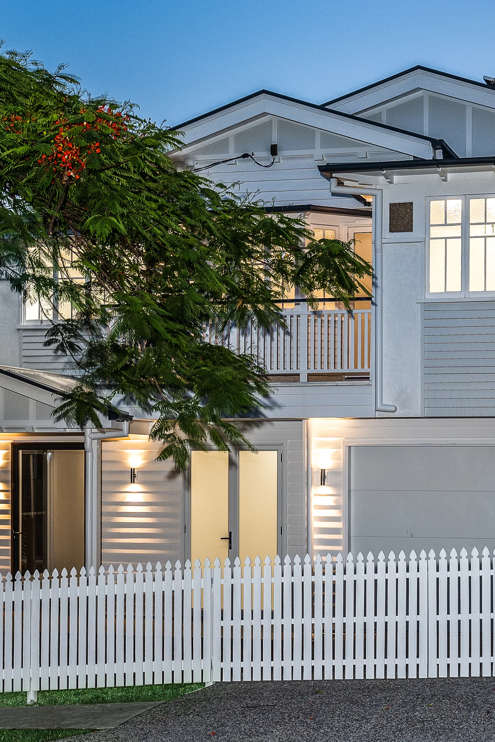white and grey Queenslander house-traditional renovation-picket fence