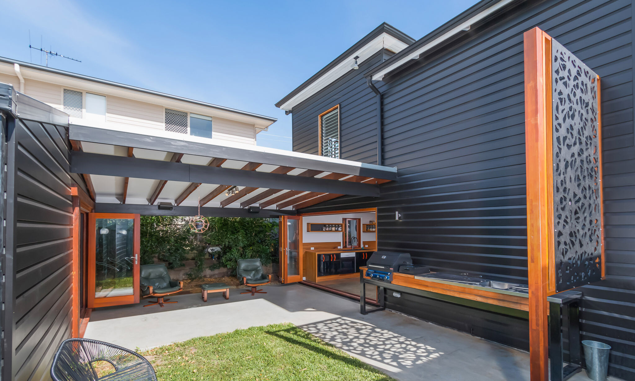 BBQ and outdoor area of black house