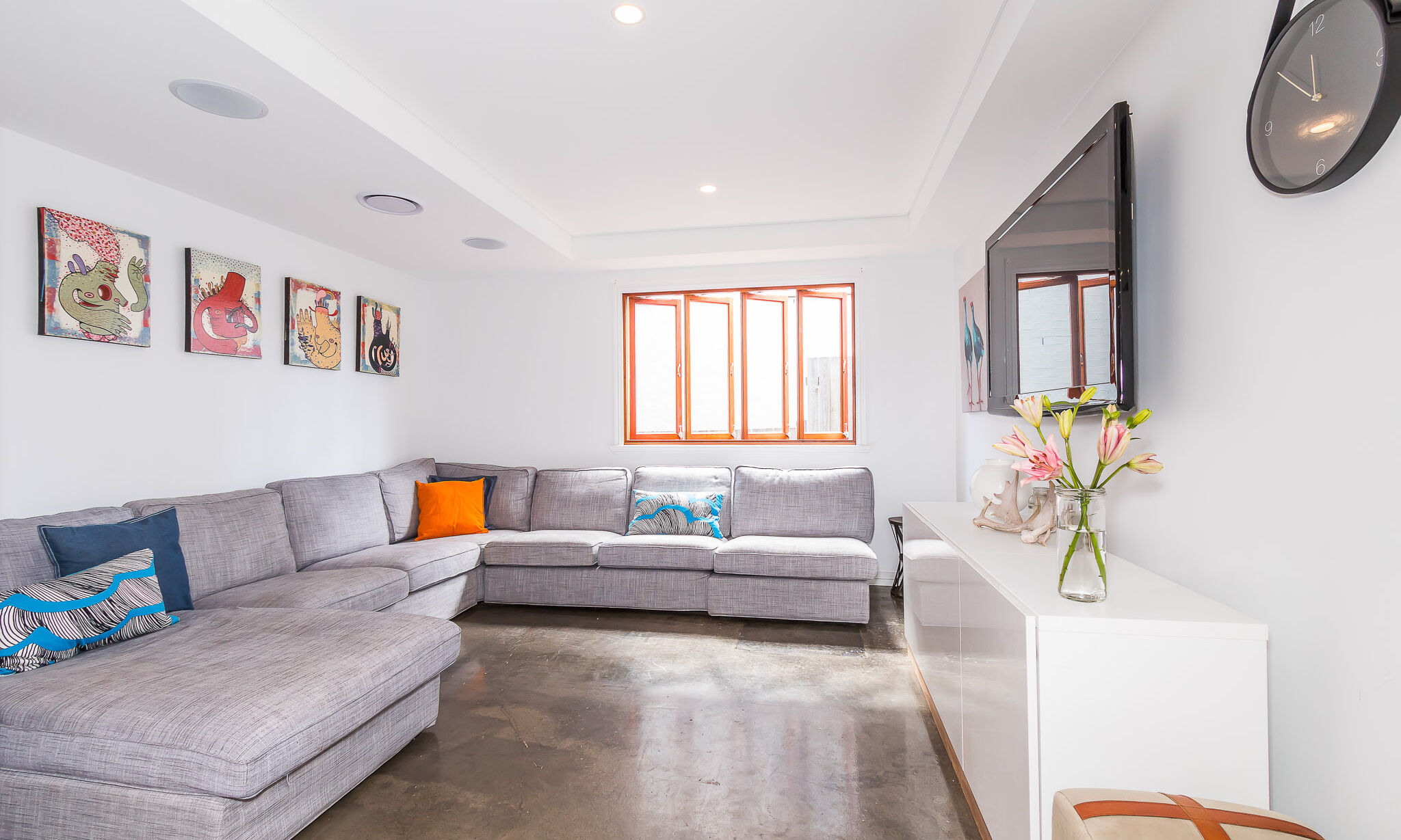 Living room with timber windows and polished concrete floor