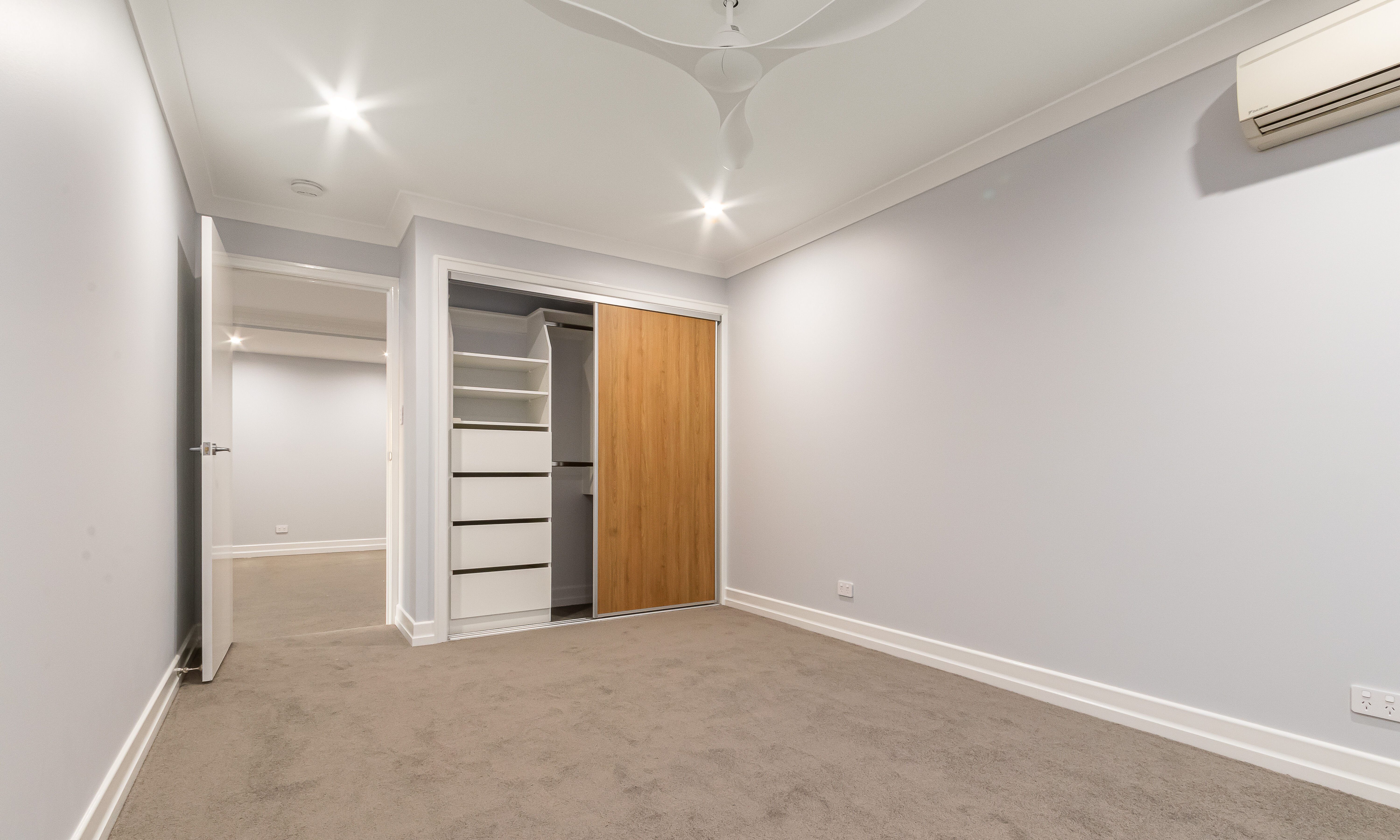  Bedroom with timber veneer robes doors