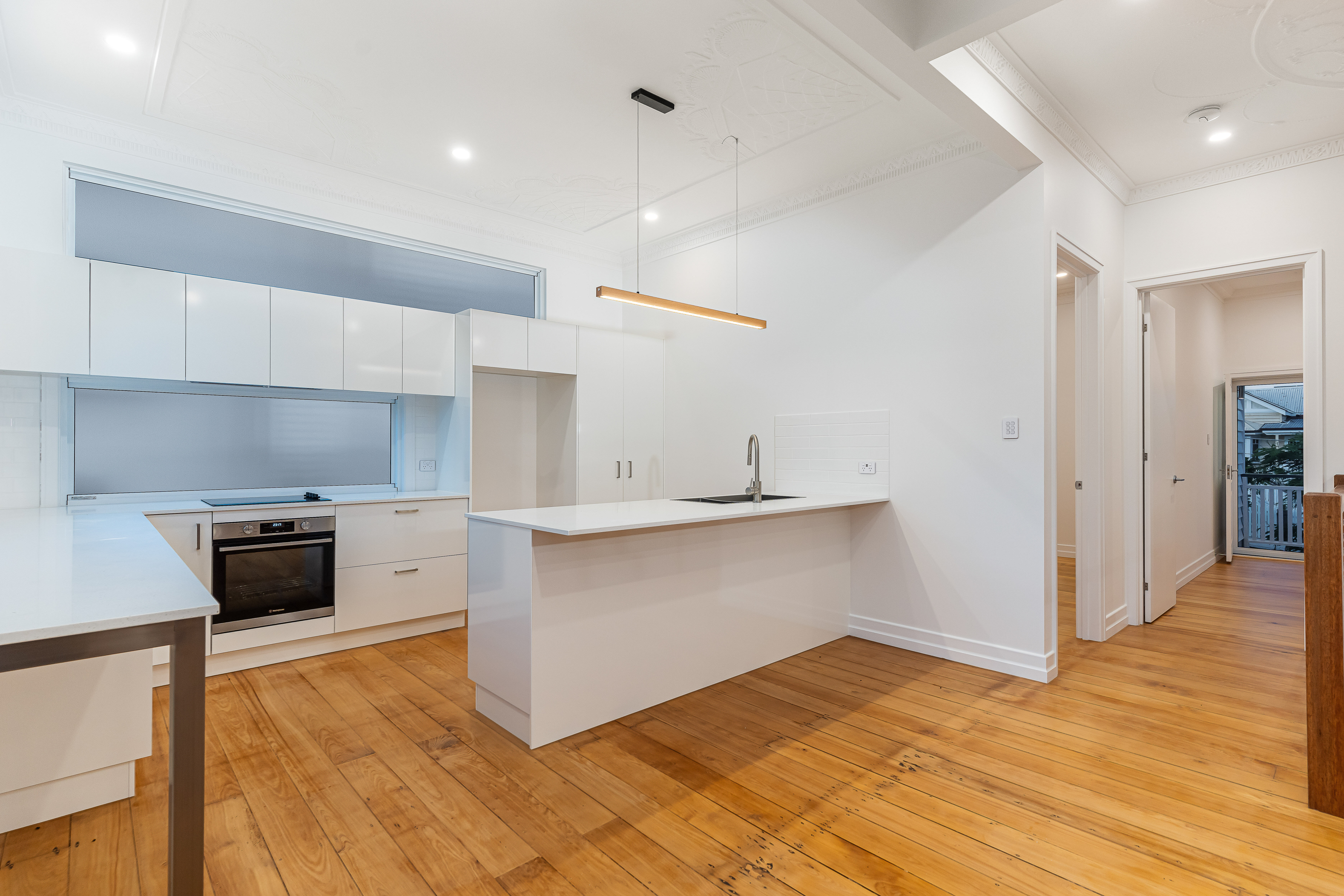 white kitchen-timber floors-pine flooring-cabinetry