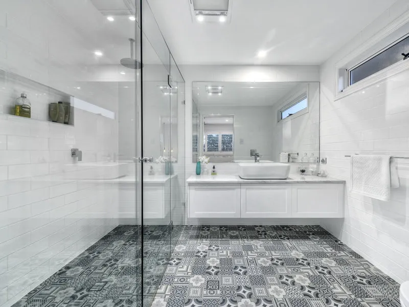 bathroom-white vanity-shower screen-black and white tiles