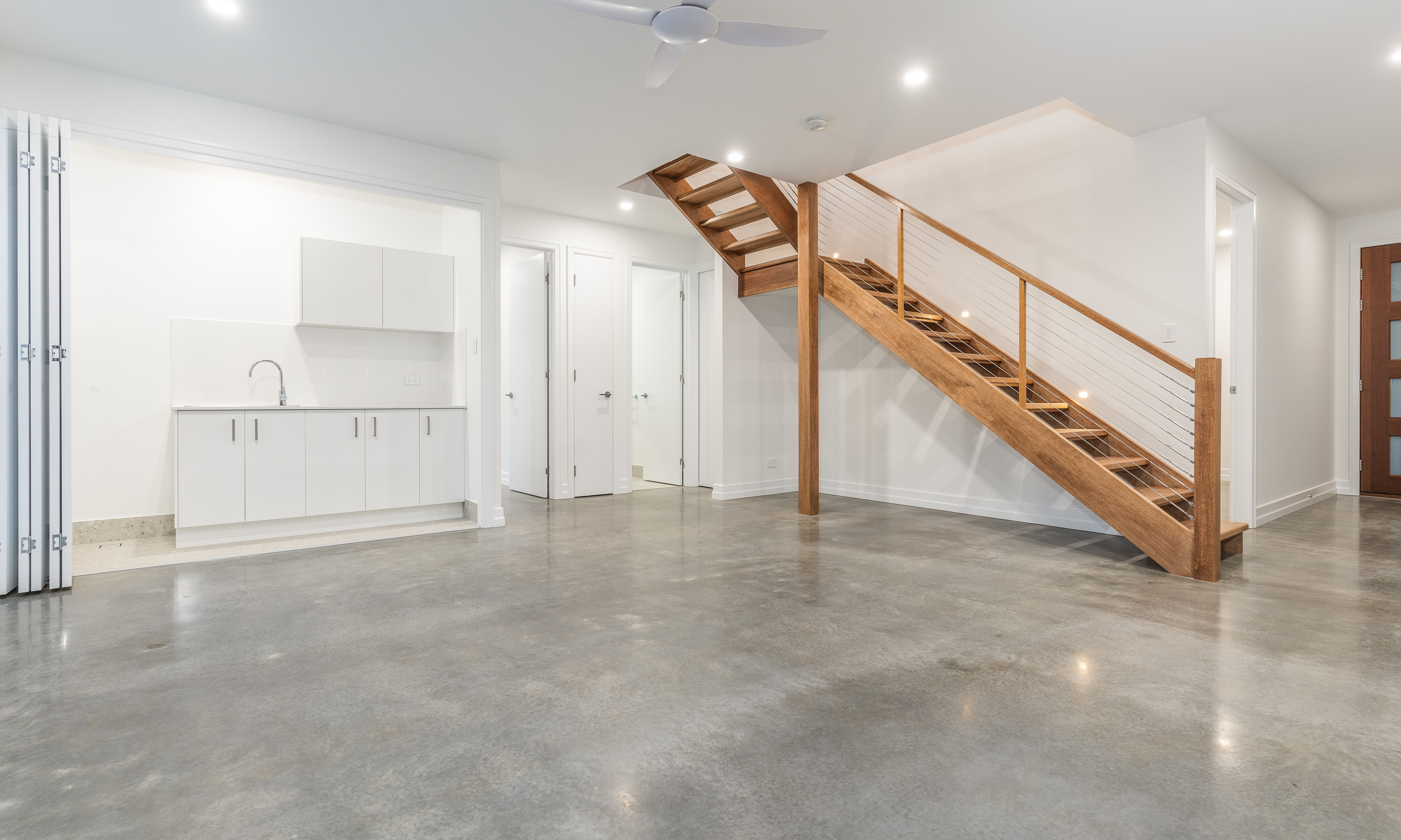 polished timber floors,laundry-stairs-wire balustrade-timber handrail