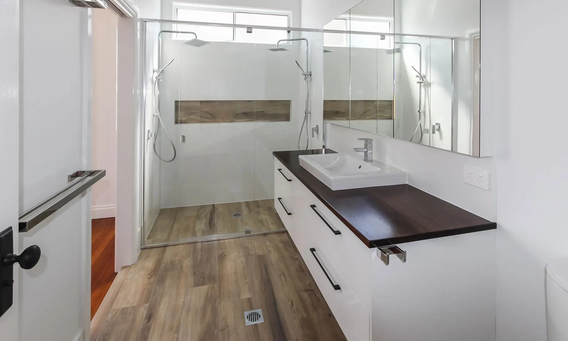 Semi-frameless shower screen and vanity with timber top