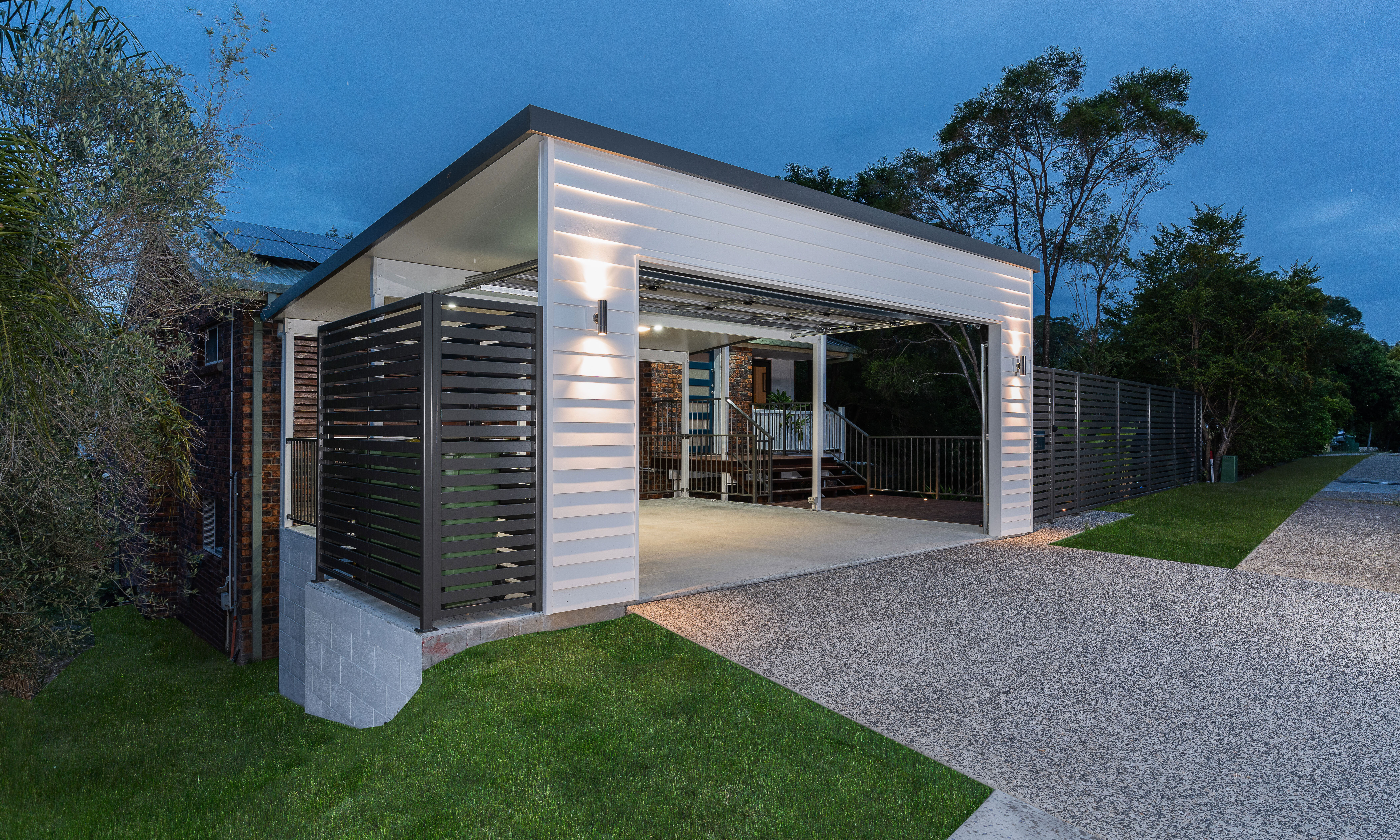 Carport and  front boundary fencing in horizontal slats