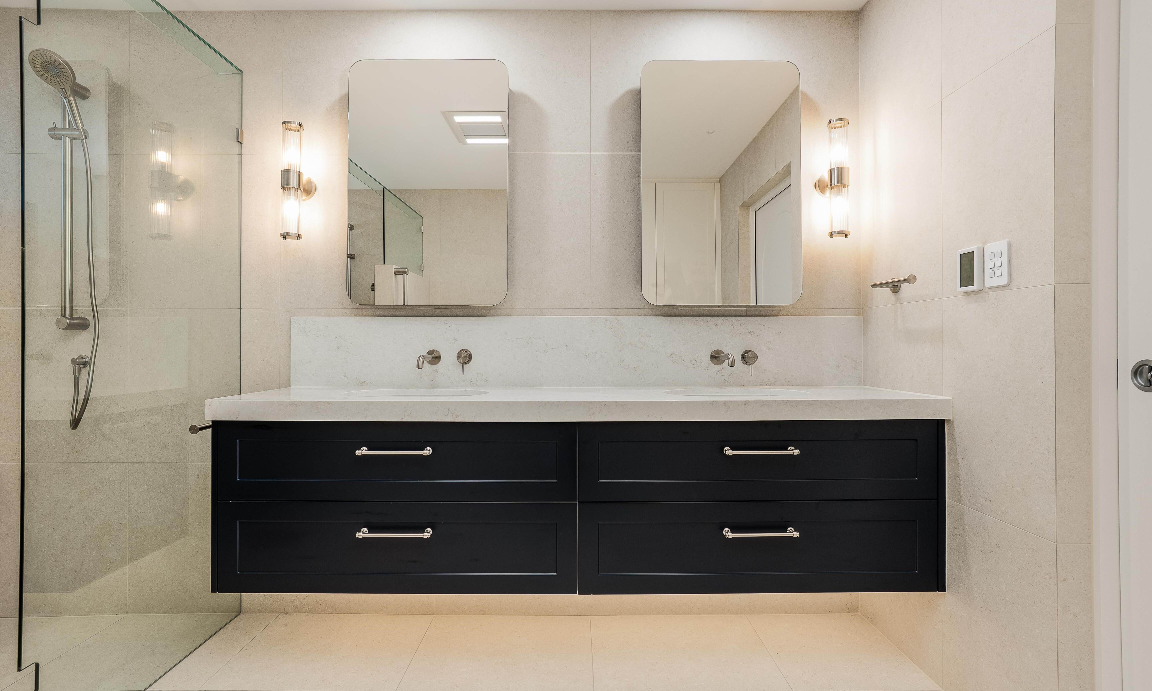 Beckenham Double Vanity, mirrored shaving cabinets, wall lights floor to ceiling tiles