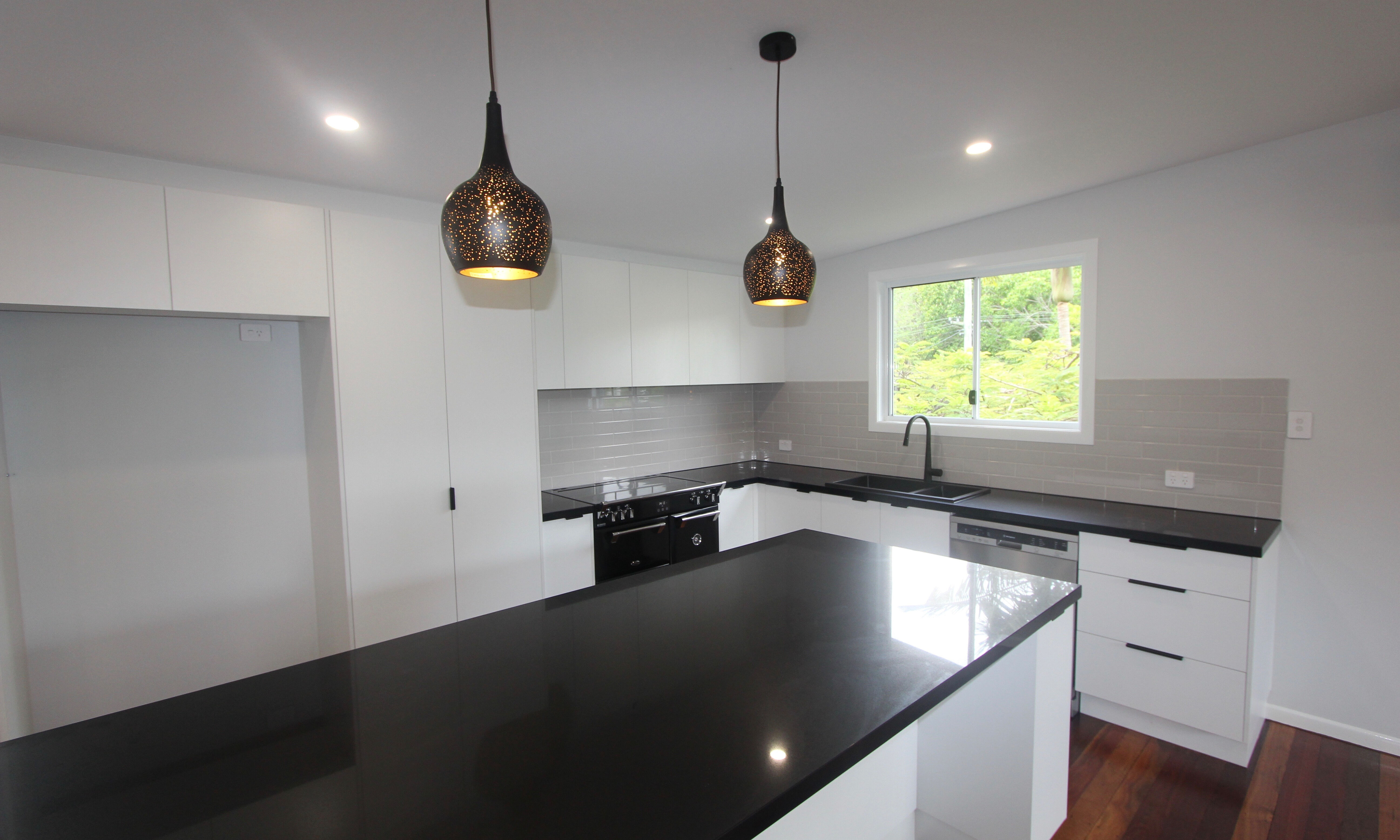 Black and white kitchen with subway tiles