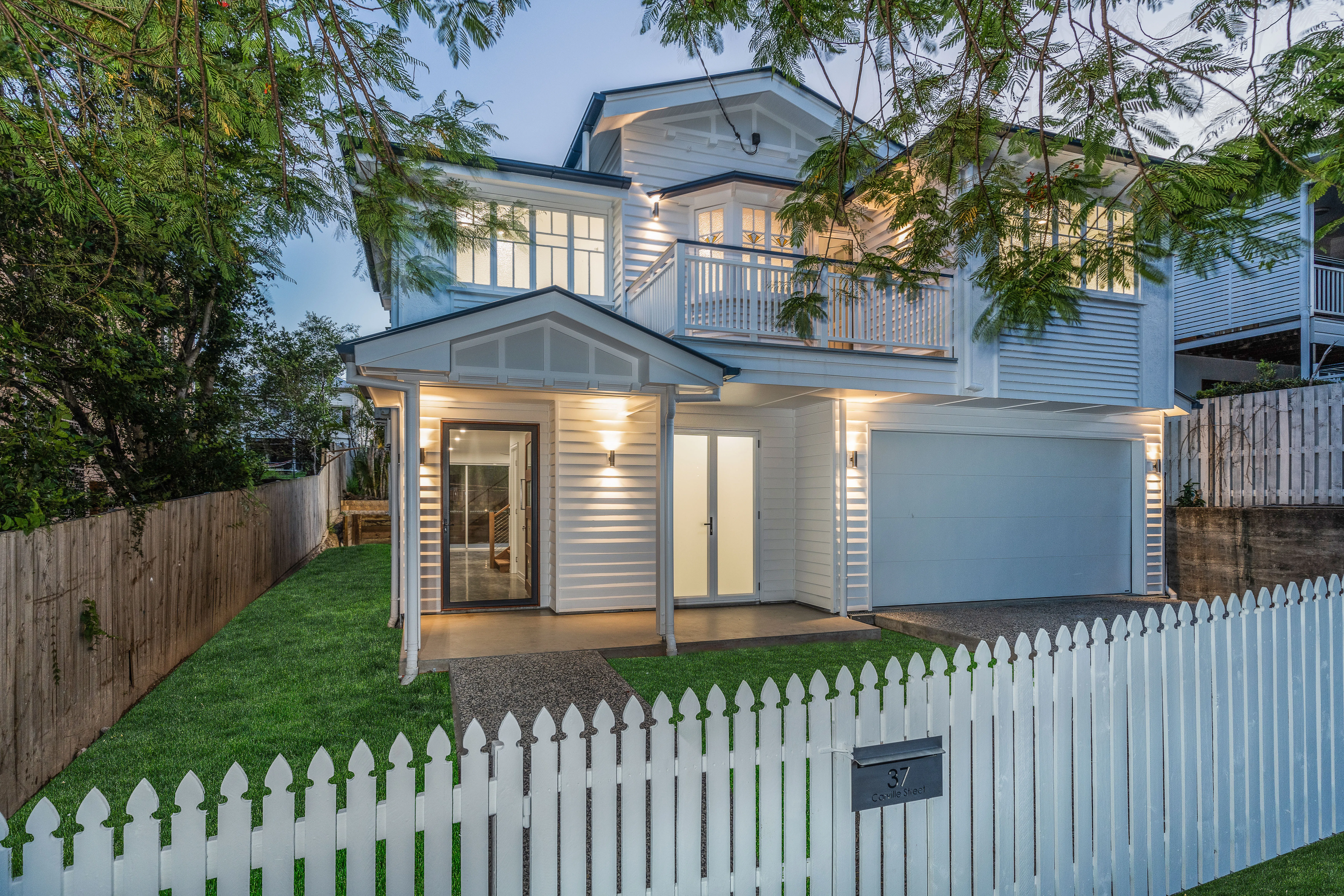 Queenslander renovation-weatherboard house-balcony- white house-picket fence
