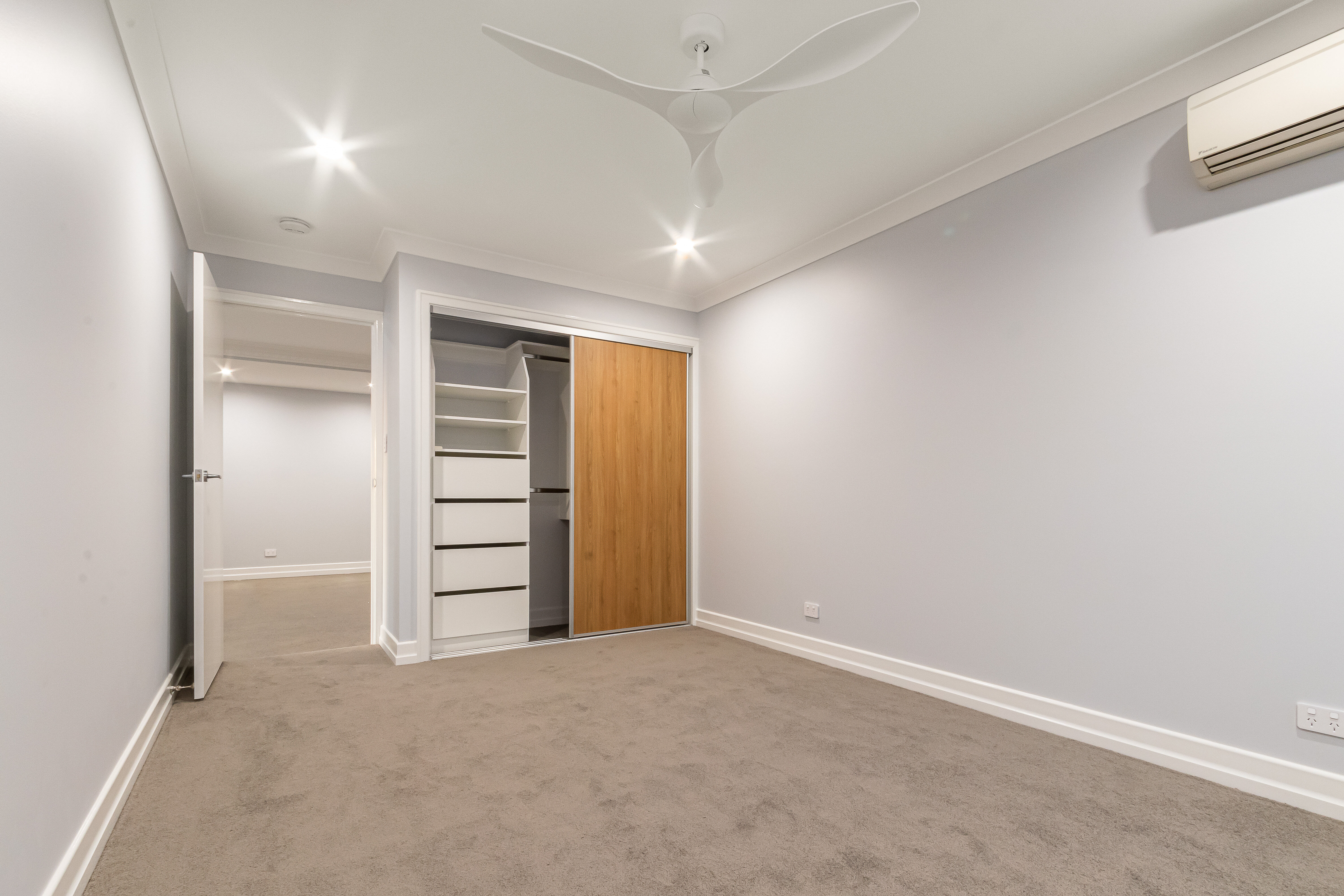  Bedroom with timber veneer robes doors