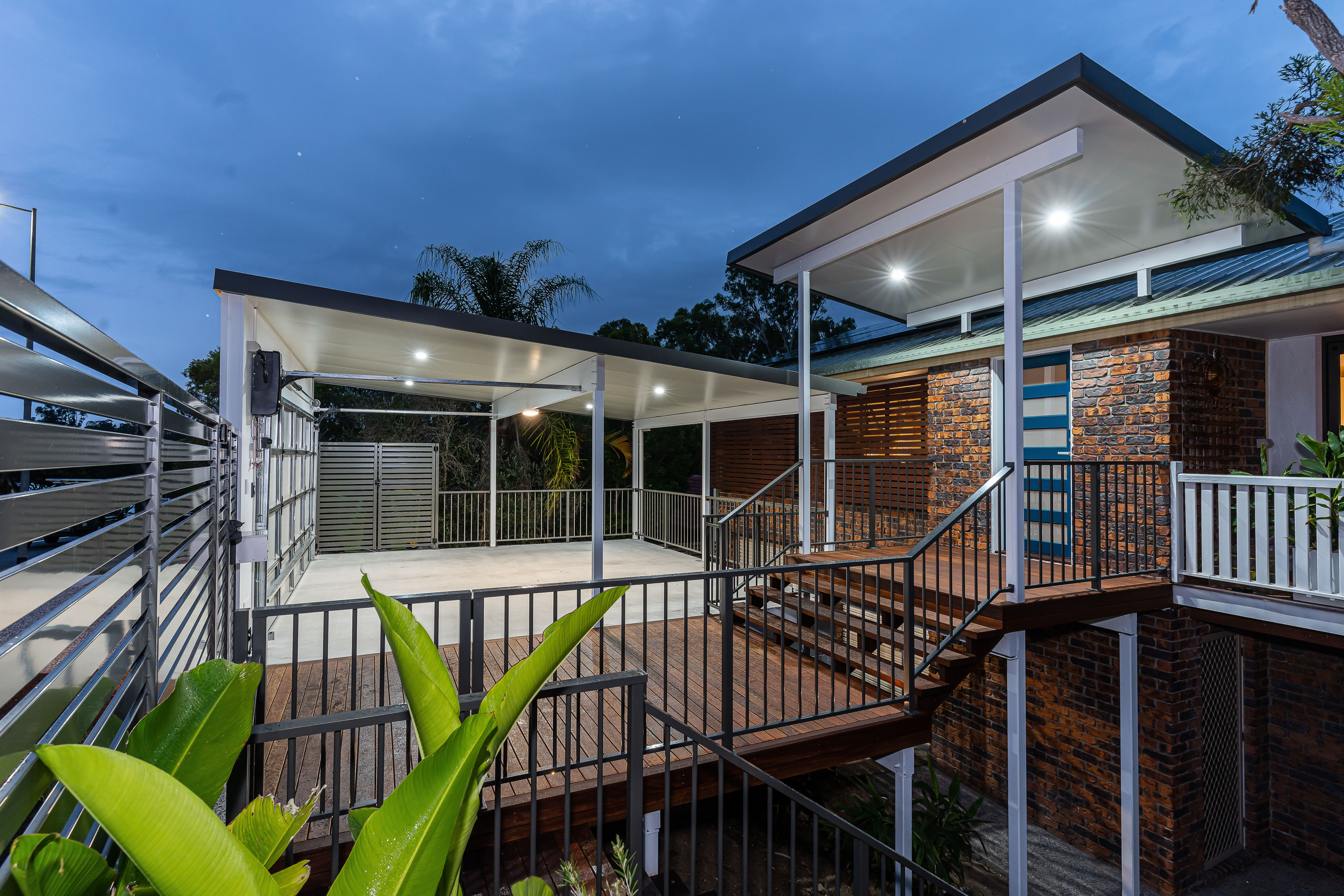 Front entry, deck and balustrade with Carport