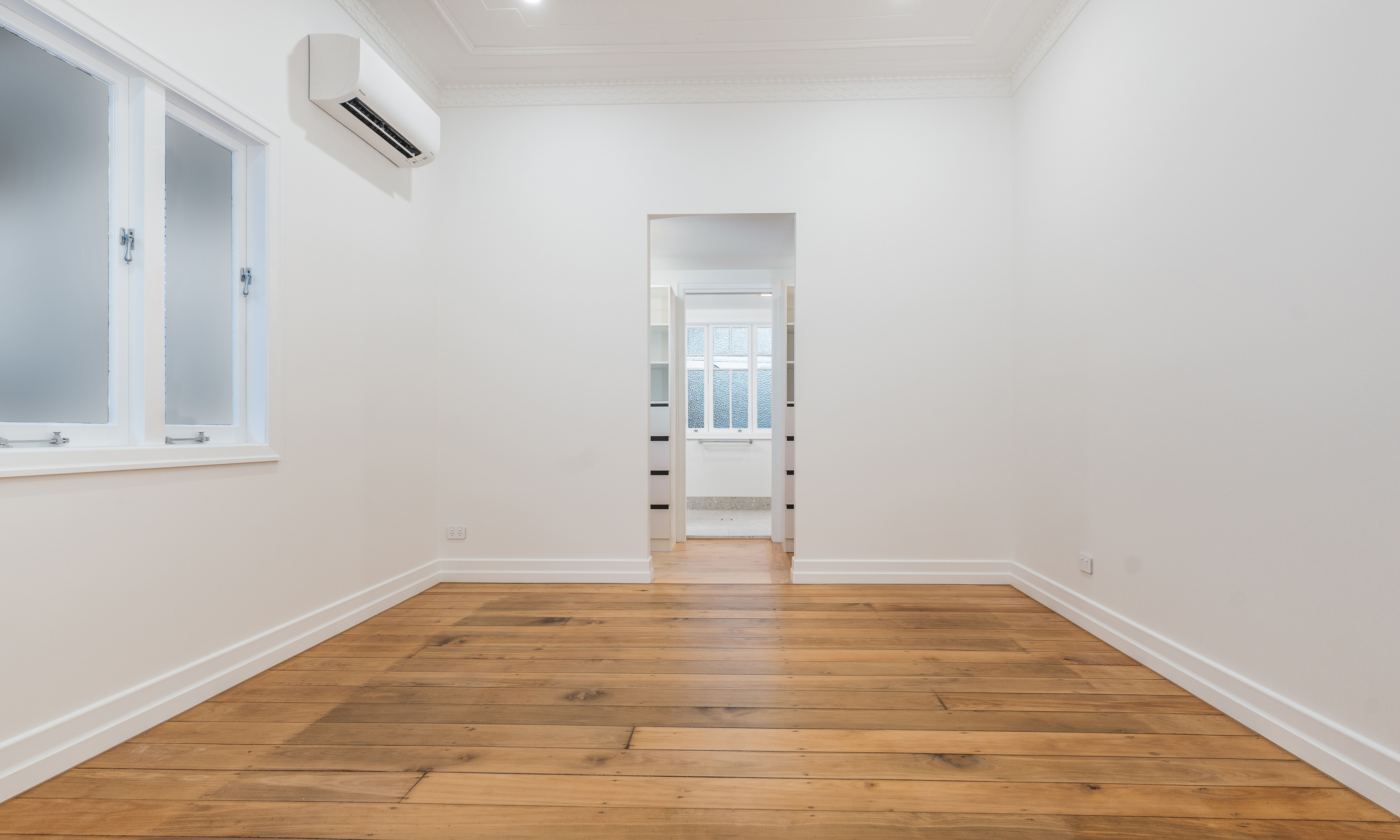 bedroom-pine flooring-casement windows