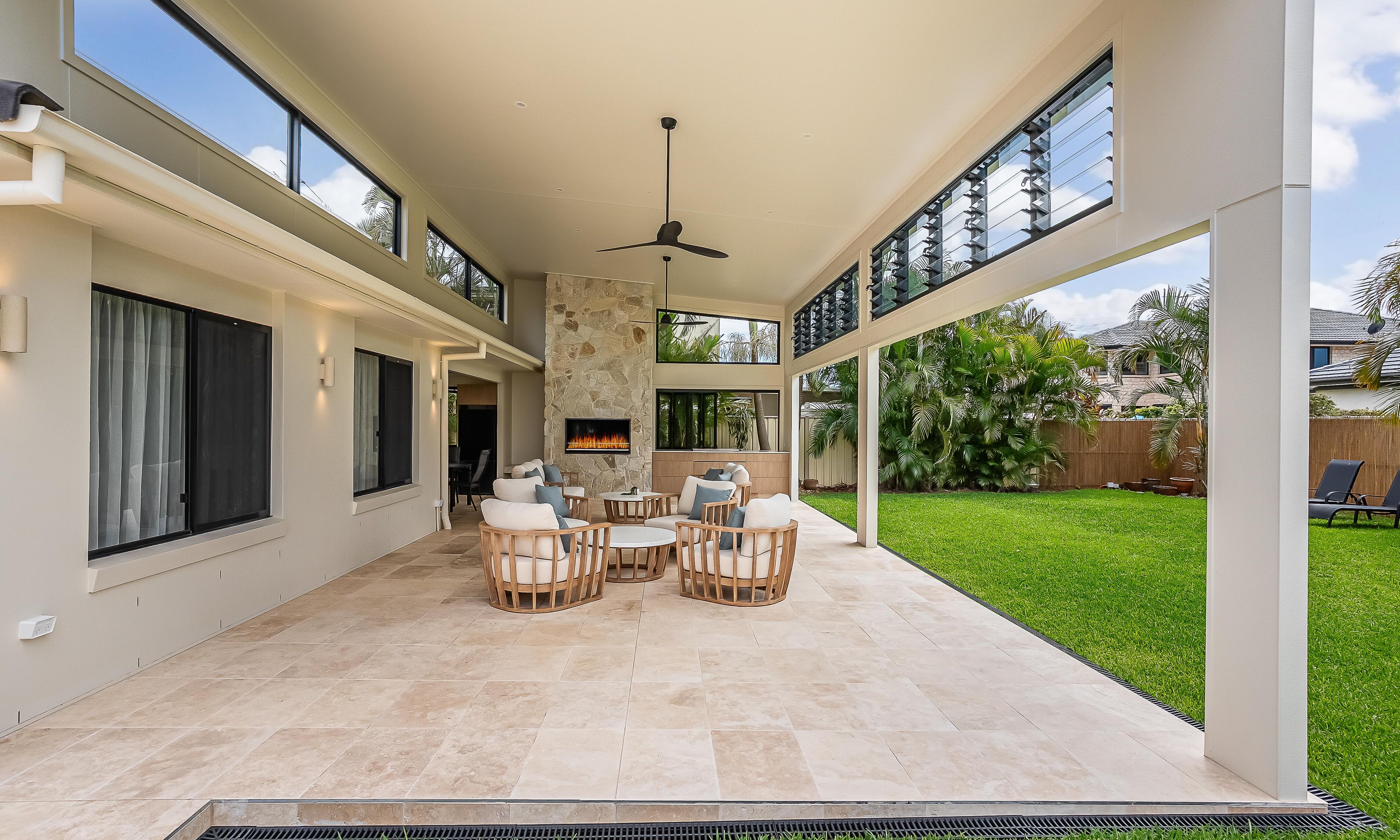 Sweetapple - bifold windows, outdoor kitchen, travertine tiles,  outdoor entertaining