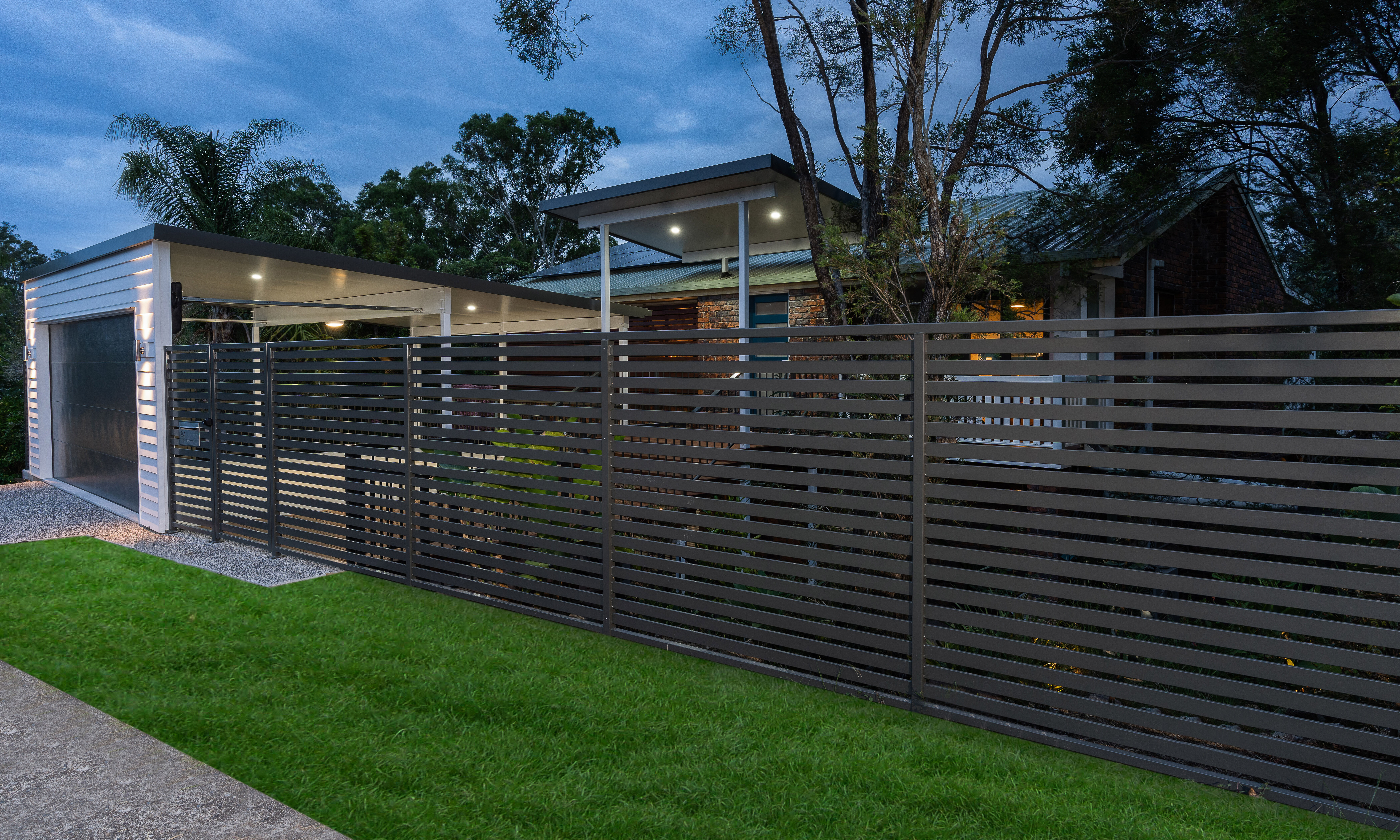 Black boundary fence in horizontal slats 