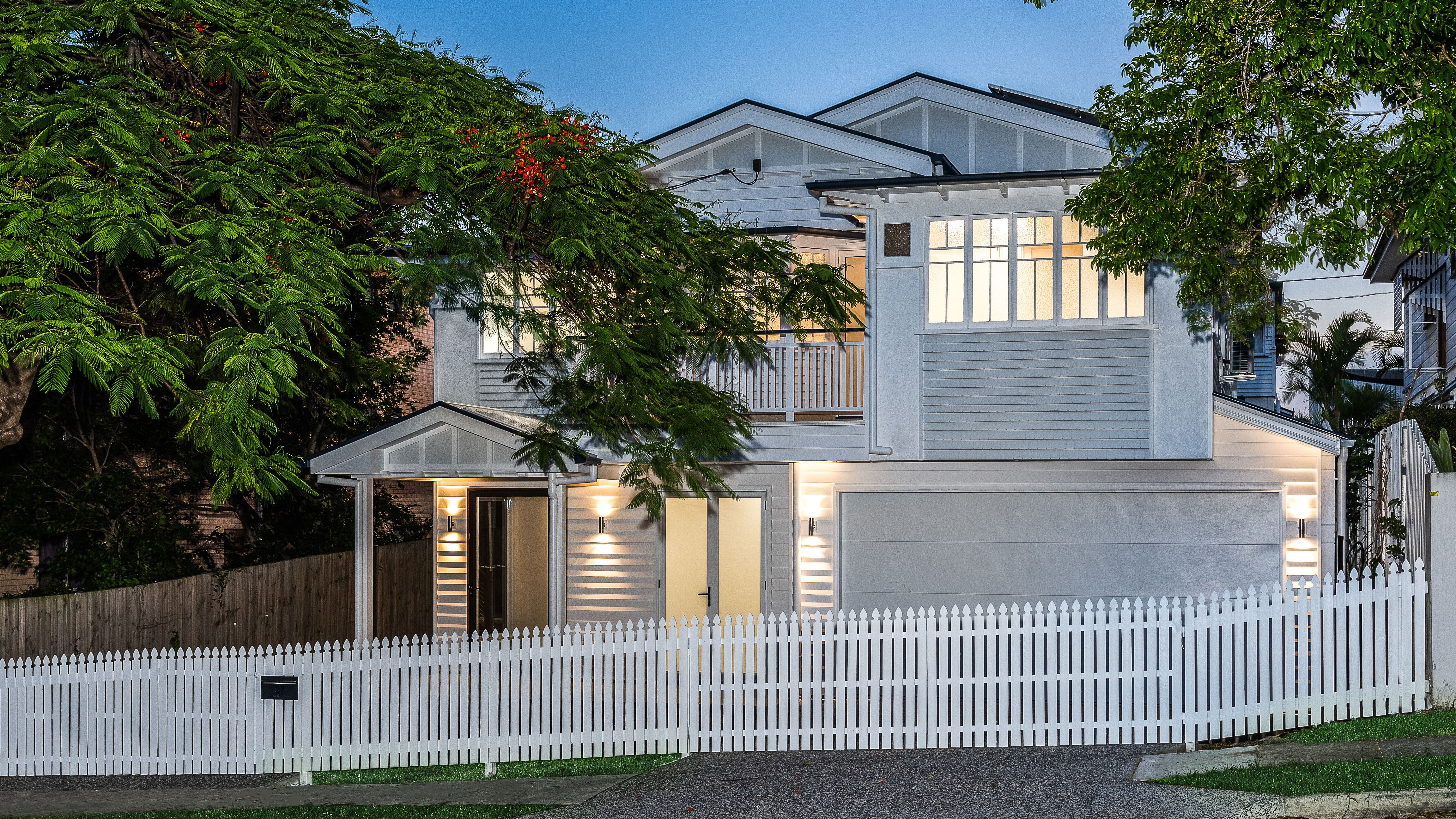 white and grey Queenslander house-traditional renovation-picket fence