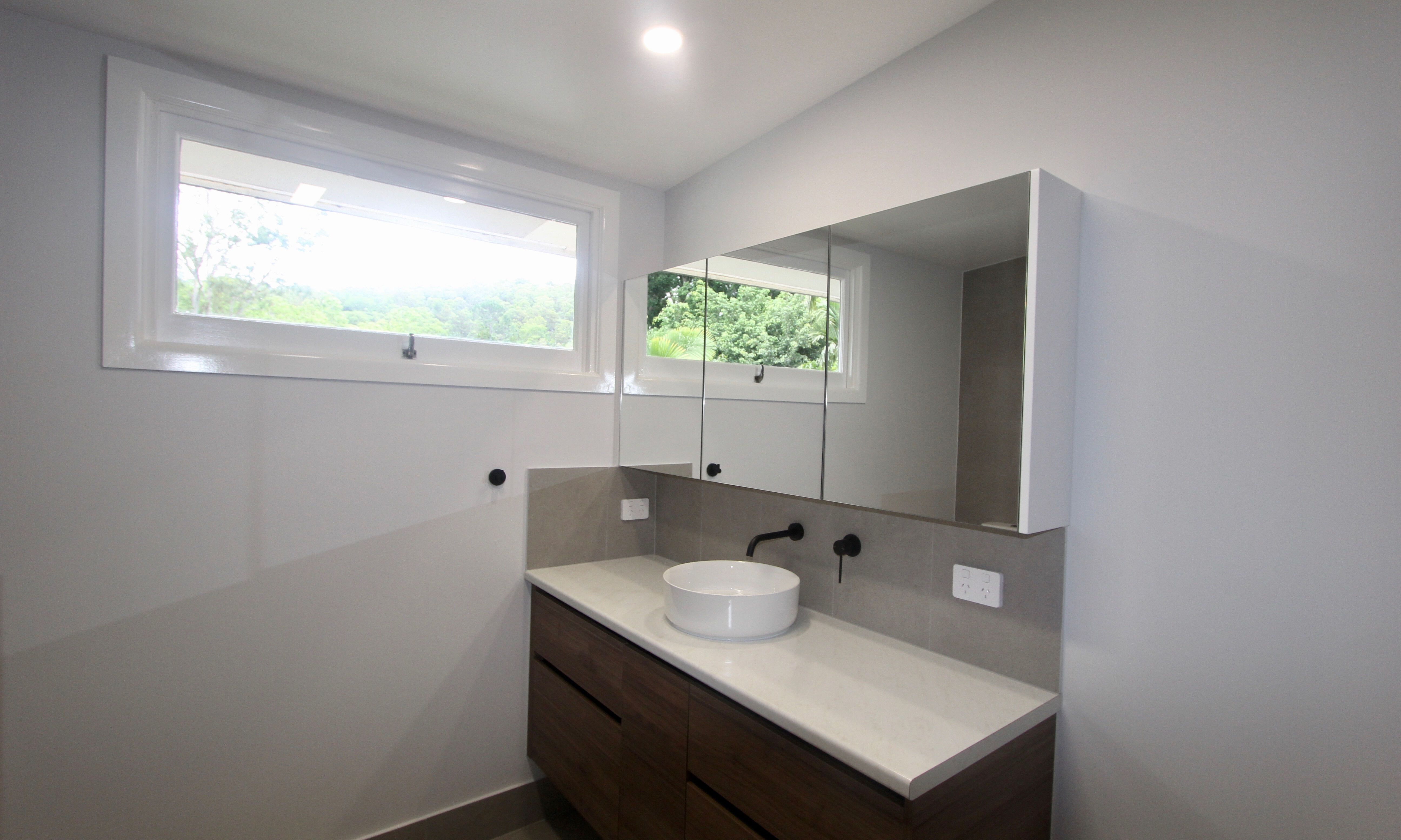 Floating Vanity and Mirrored Shaving Cabinet in Bathroom at The Gap