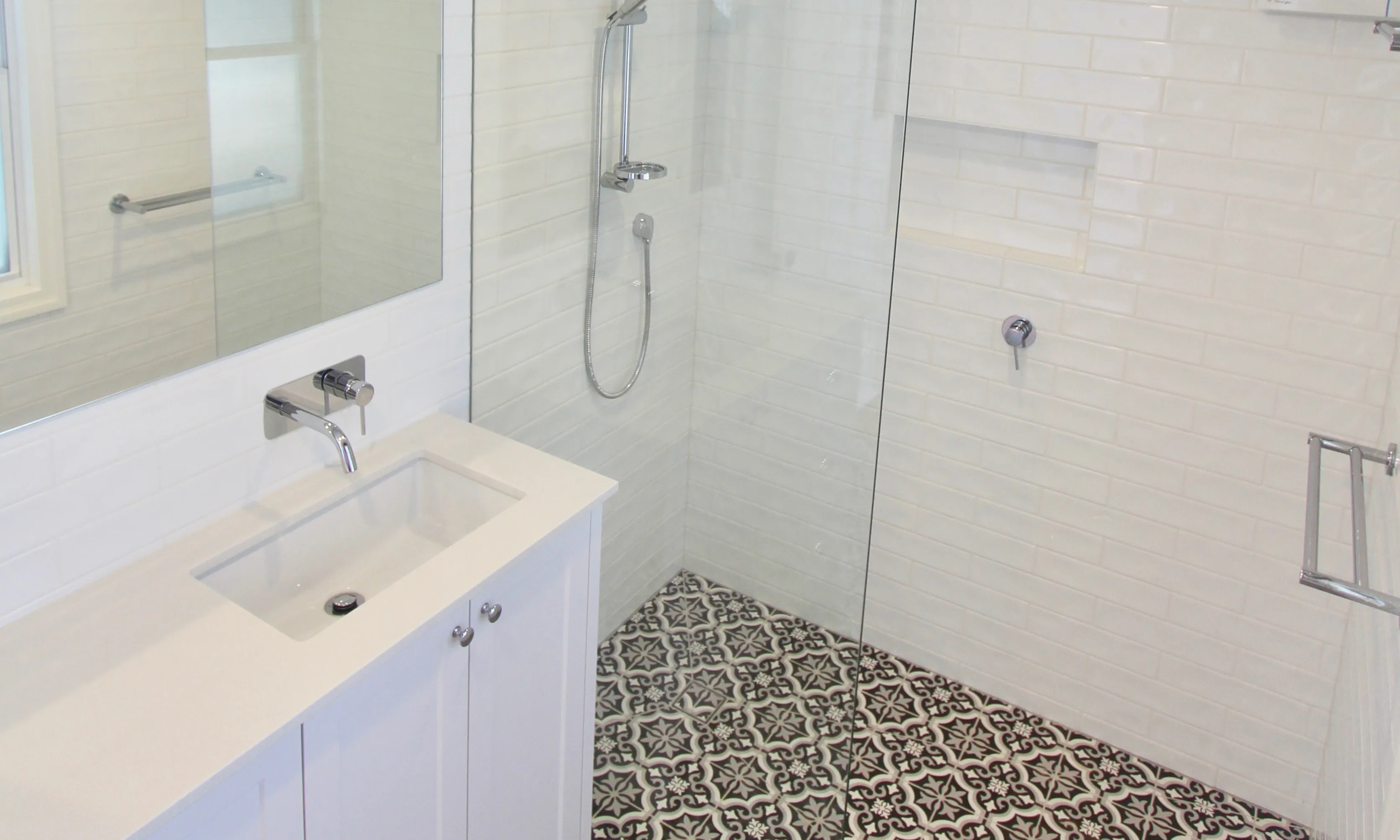 Bathroom with white vanity-black and white floor tiles