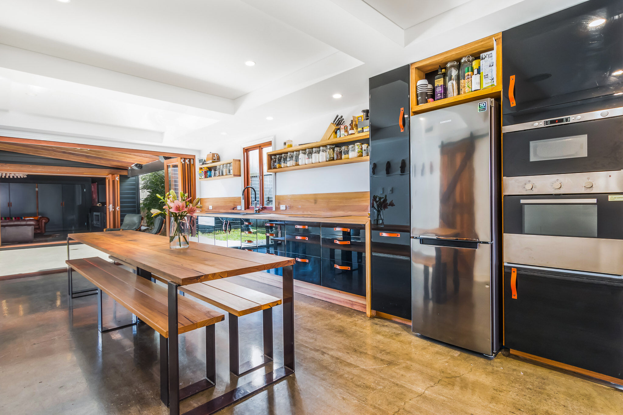 Black kitchen with leather pull handles