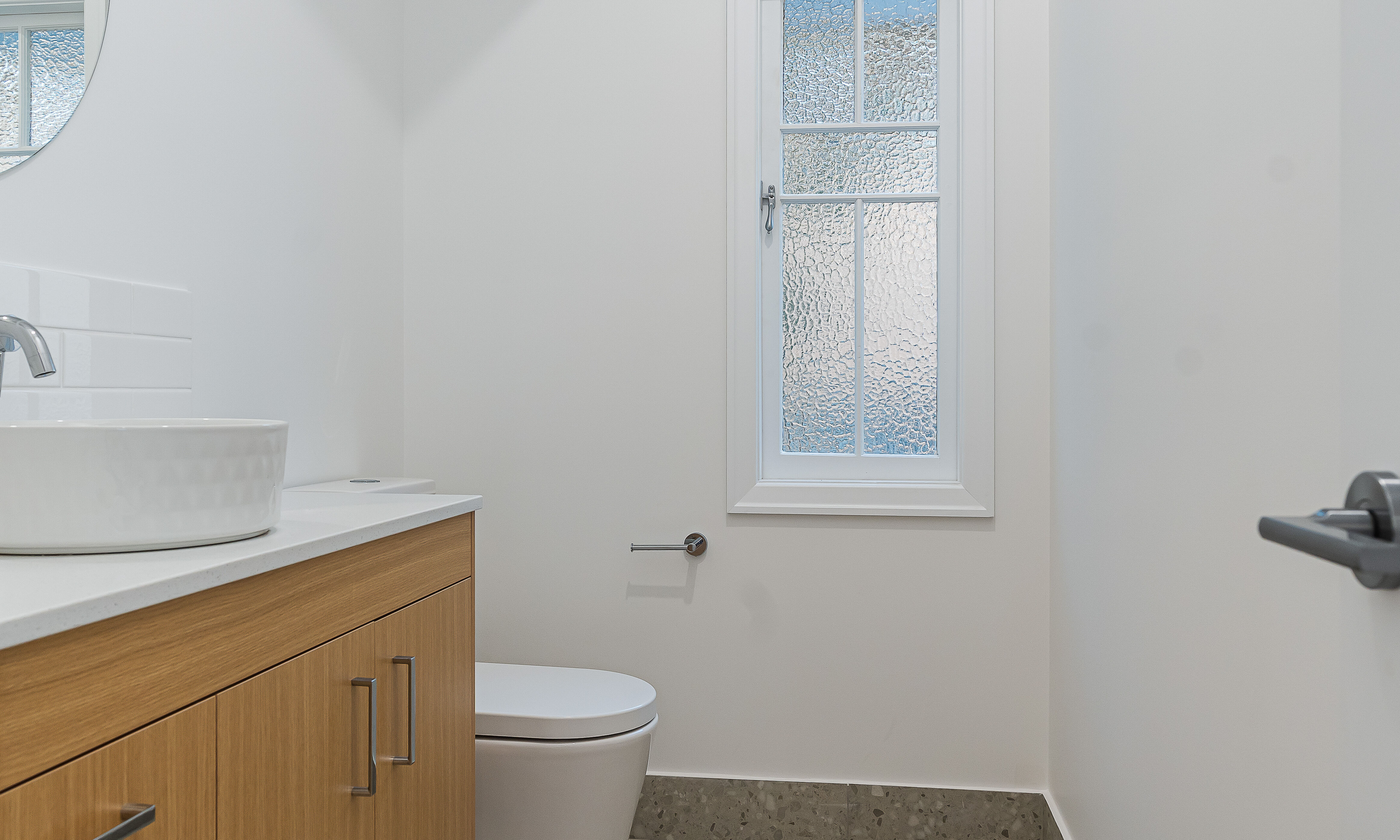 Tiled Floor and Floating Vanity in  powder room Annerley