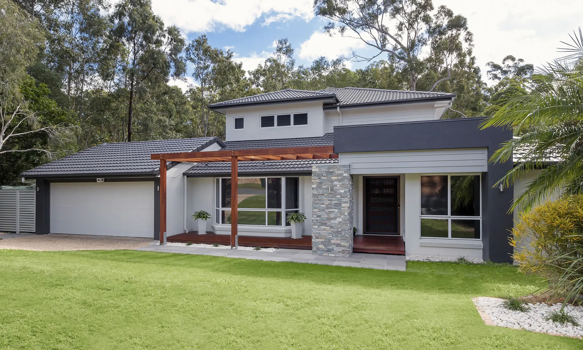 Front house with tiled entry and timber pergola