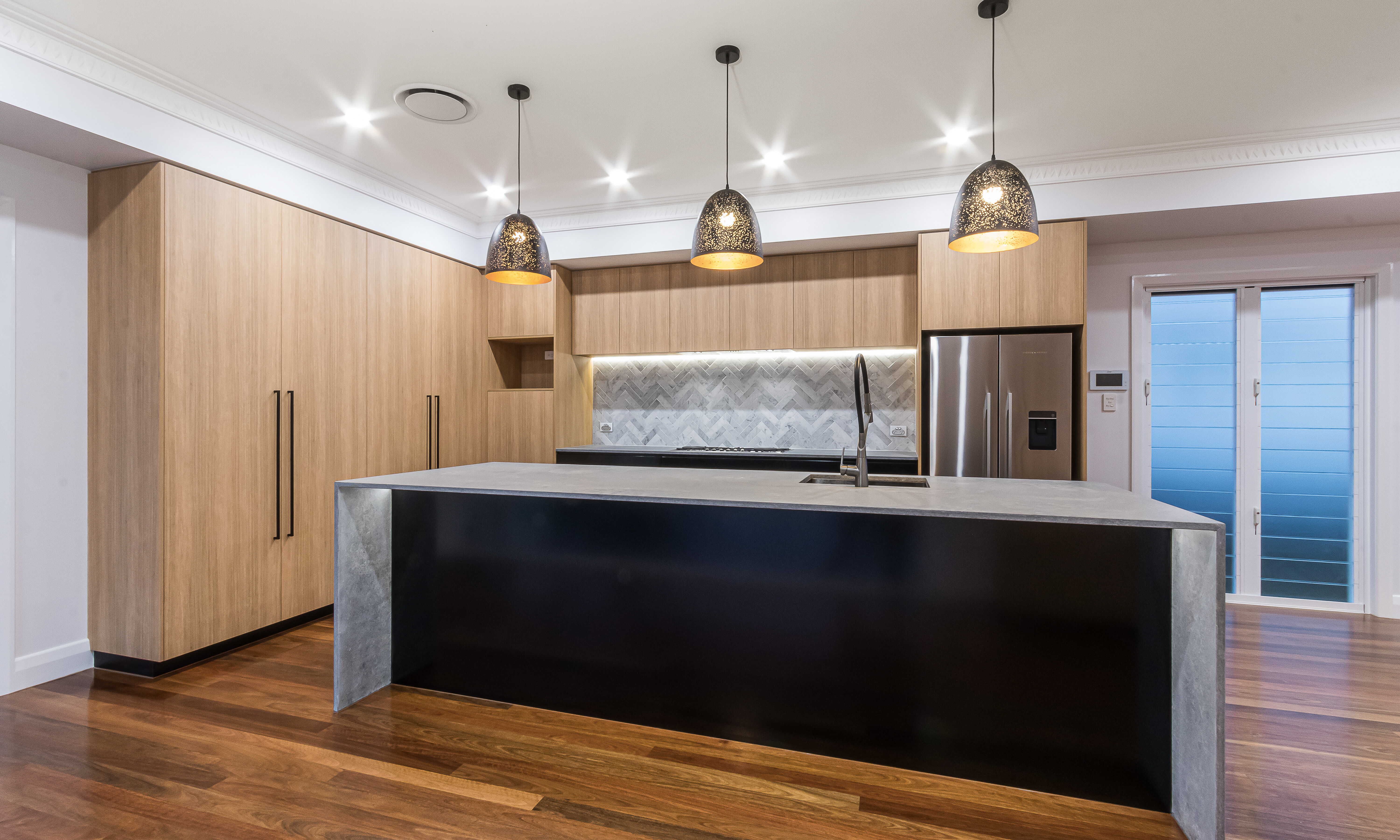 timber kitchen-led strip lights-marble tiles-splashback-stone benchtop